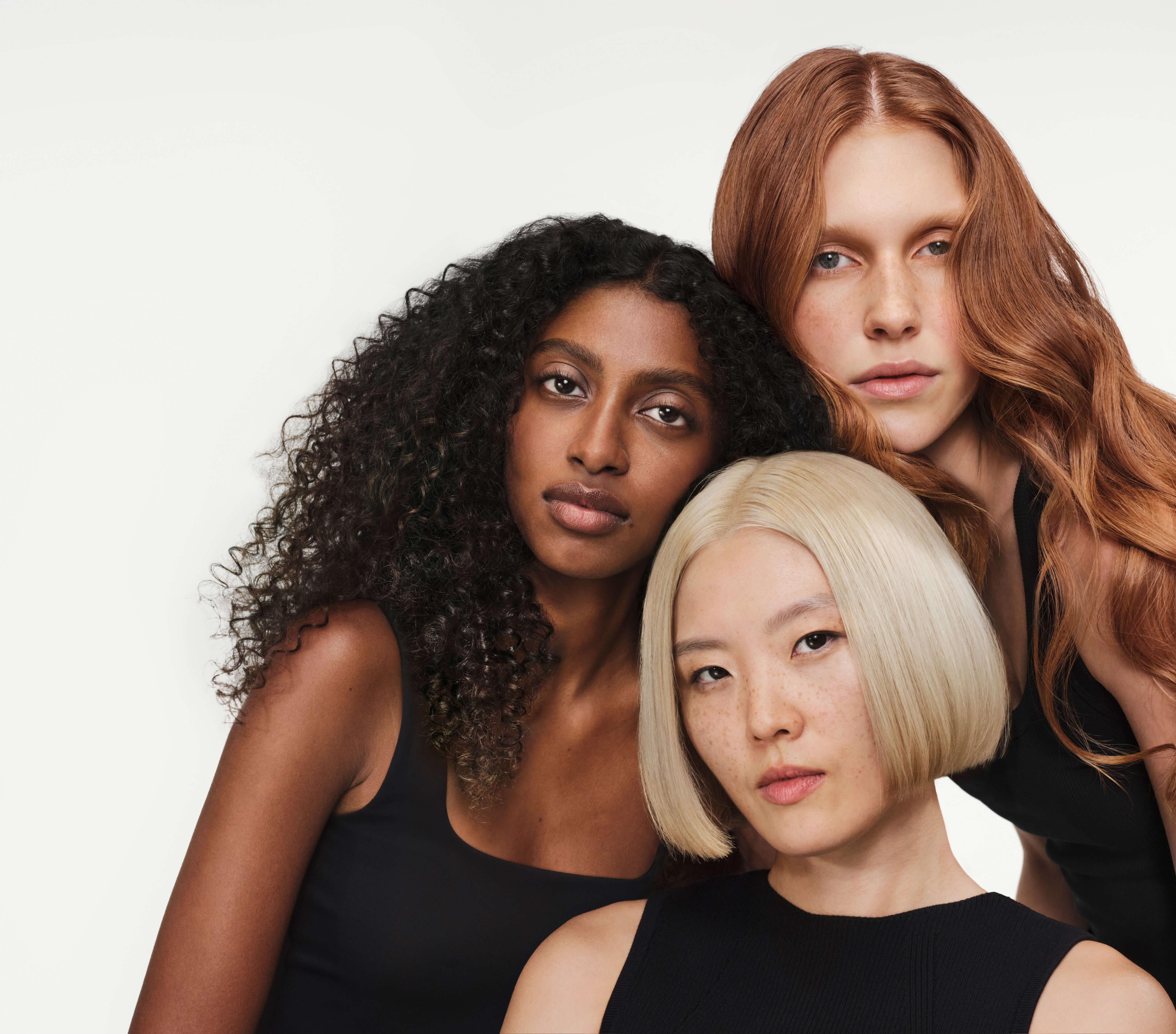 What kind of hair does olaplex work on? Image showing Olaplex models of Asian, African and Irisih hair types